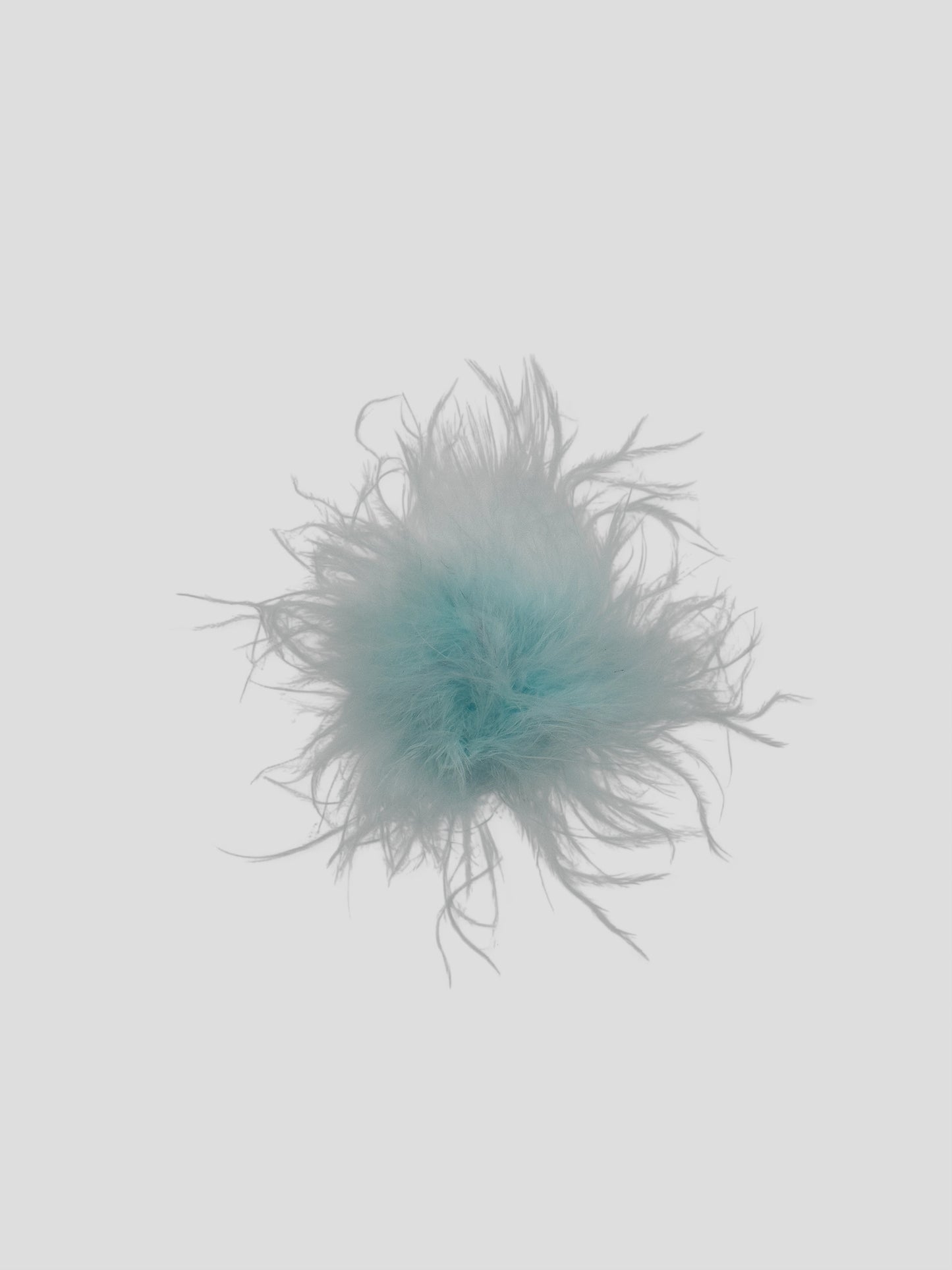 Pompon met stickertje lichtblauw 3cm