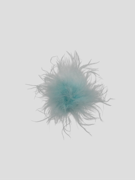 Pompon met stickertje lichtblauw 3cm